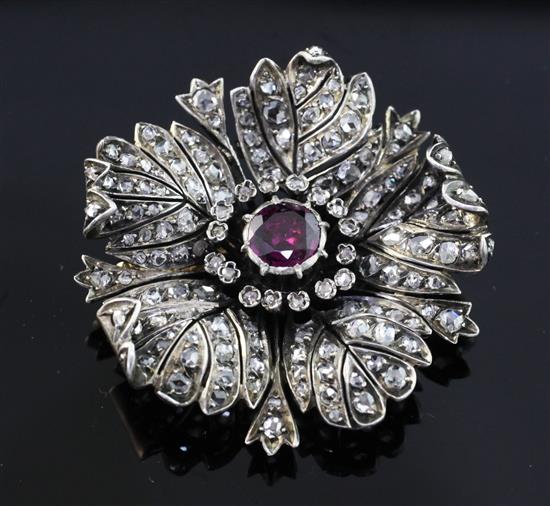 A late 19th/early 20th century French 18ct gold and silver, garnet and rose cut diamond set pendant brooch, 1.5in.